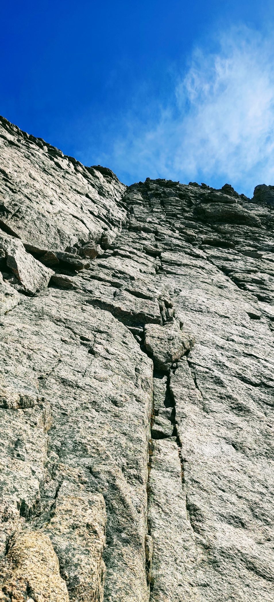 A close-up of a rock wall leading to the summit of Longs Peak