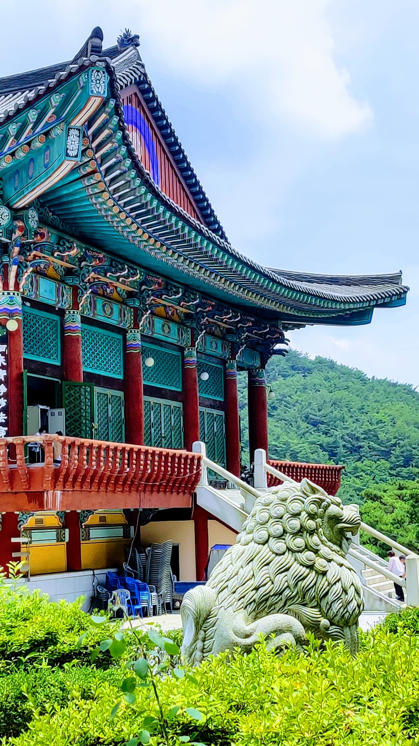 a larger-than-life buddhist structure in south korea covered with a lion sculpture Donghwasa Daegu