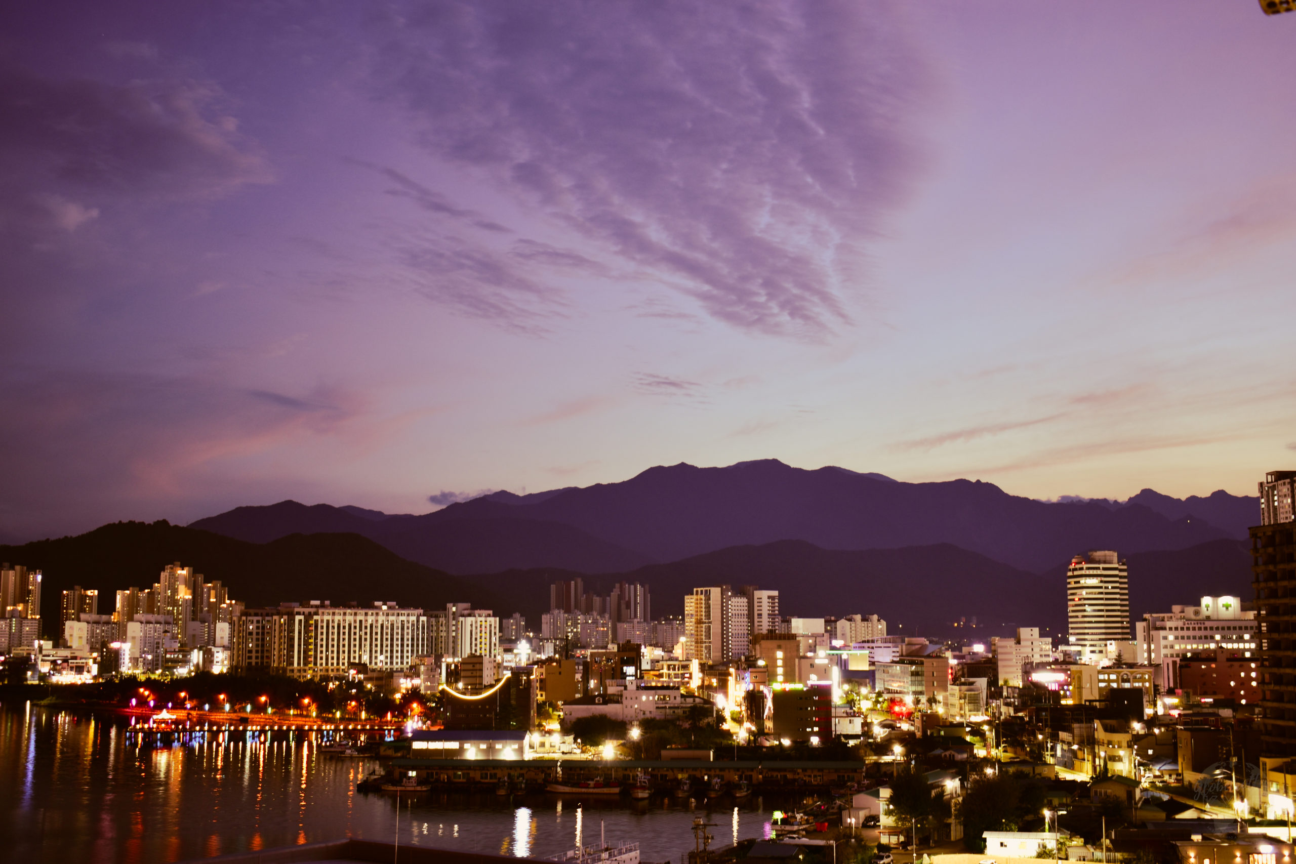 The Sokcho cityscape and Cheongcho Lake in front of the Taebaek mountain range at sunset