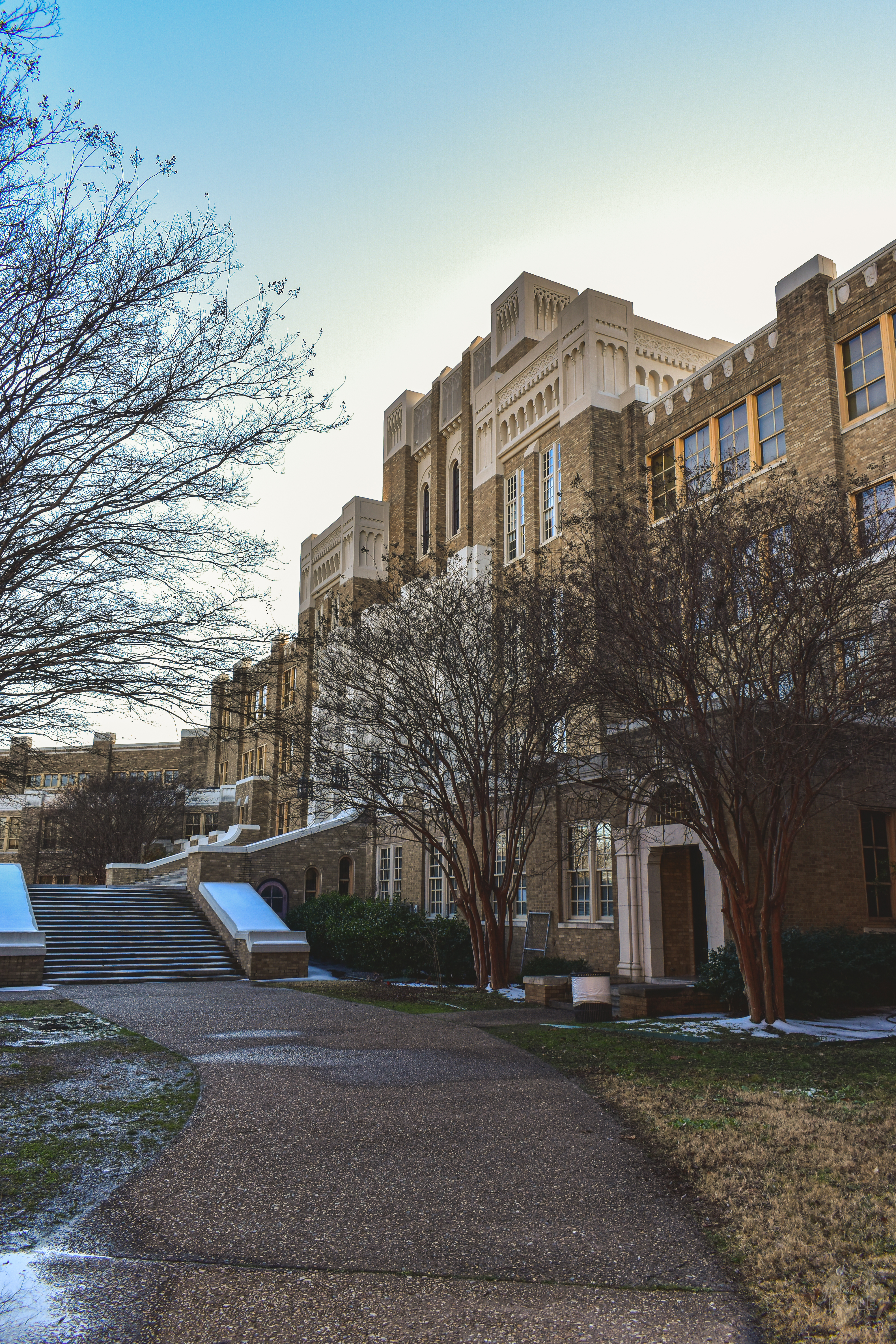 Little Rock Central high School historic site an old historic brick building with trees and snow in foreground