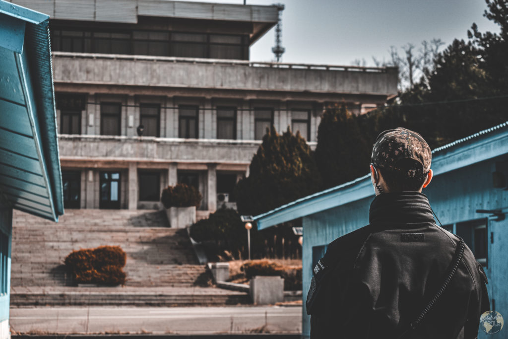 A South Korean soldier stands guard, looking towards North Korea at the JSA inside the DMZ