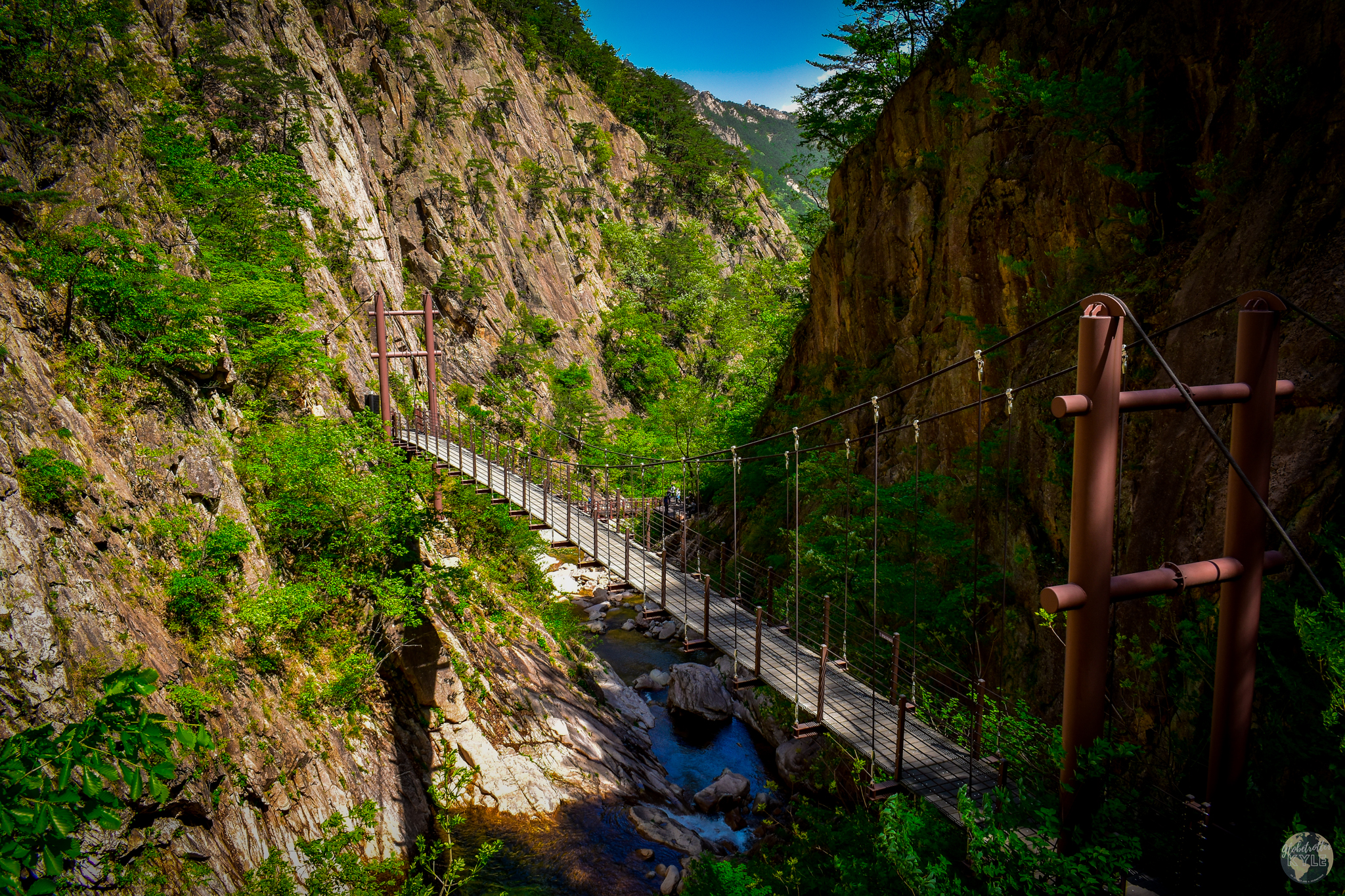 A bridge over a river in the middle of a valley in Seoraksan National Park, South Korea Guide for Sokcho and Seoraksan