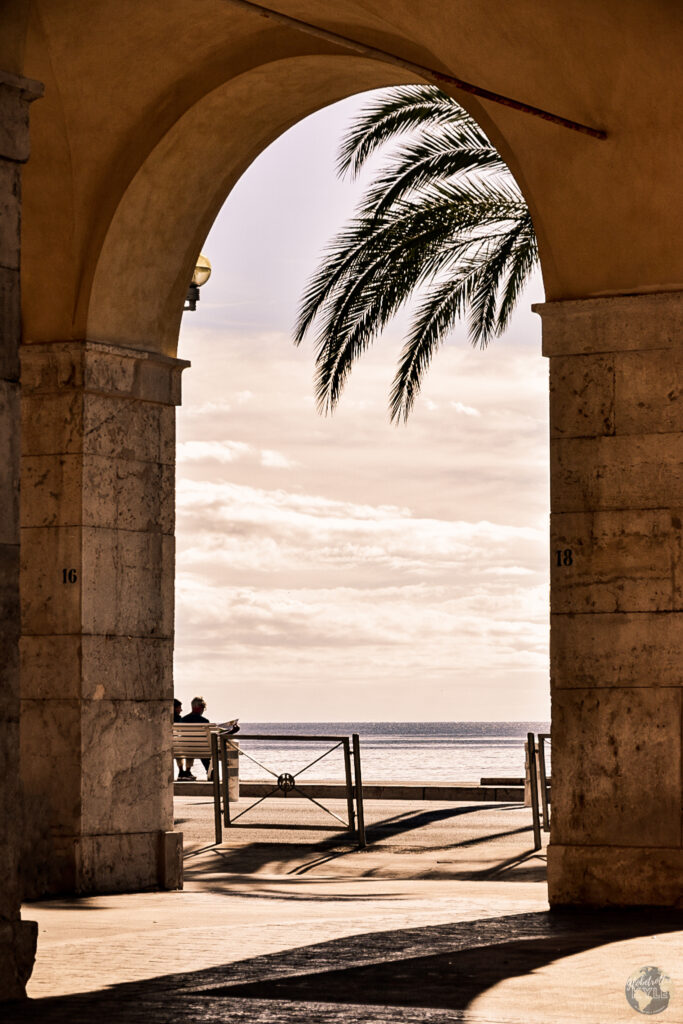 An iconic archway in Nice, France where many hotels offer a place to stay