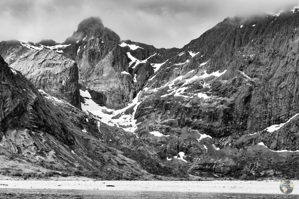 a black and white photo of a rocky mountain