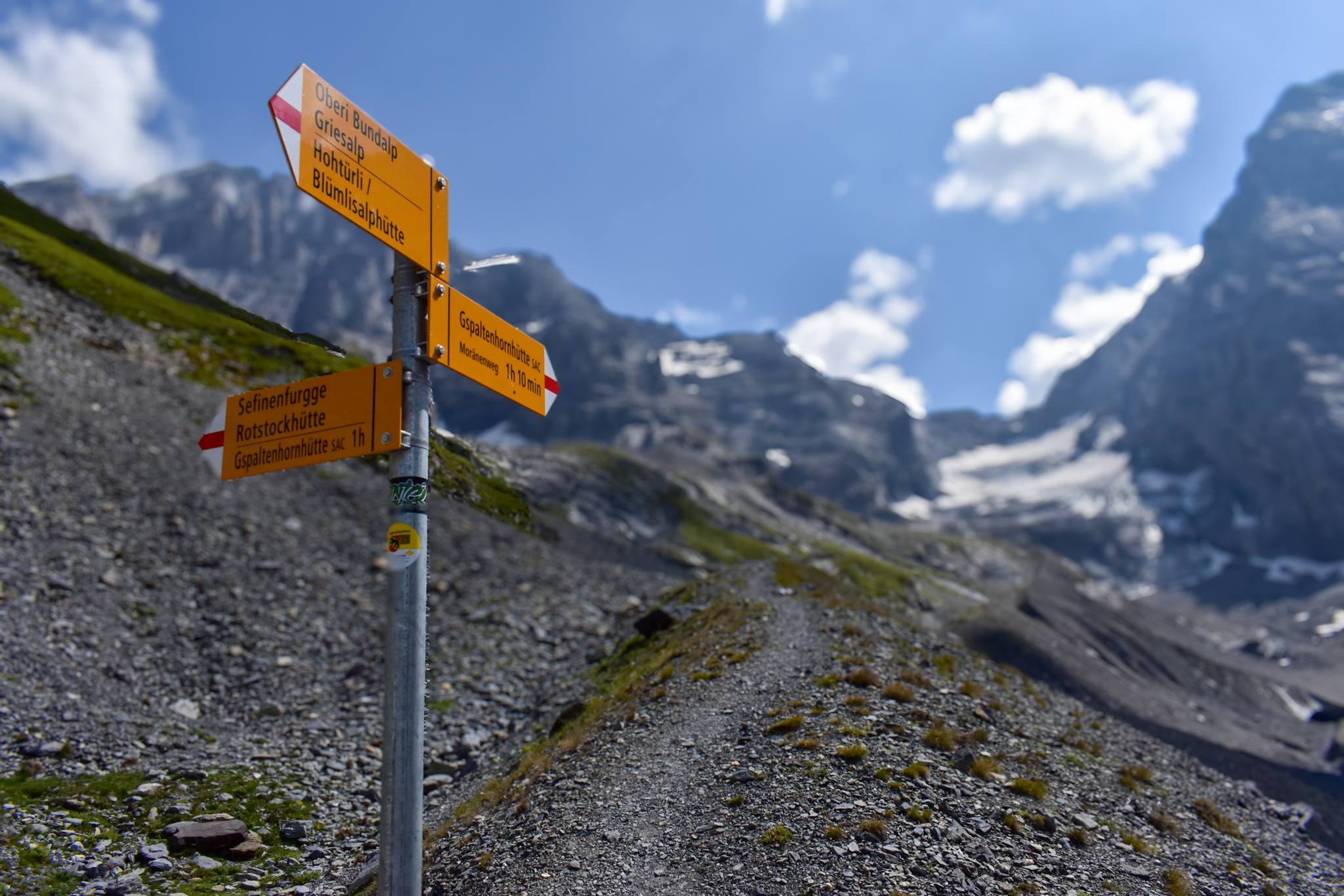 Trail markers in the Swiss Alps for hut to hut hiking in Switzerland