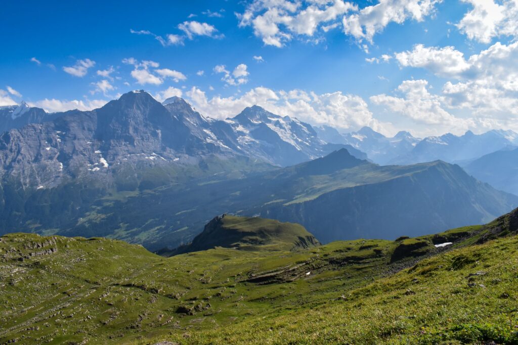 Mountains in the Jungfrau range of Switzerland with the Kleine Scheidegg mesa in front at sunset along a hut to hut hike in switzerland