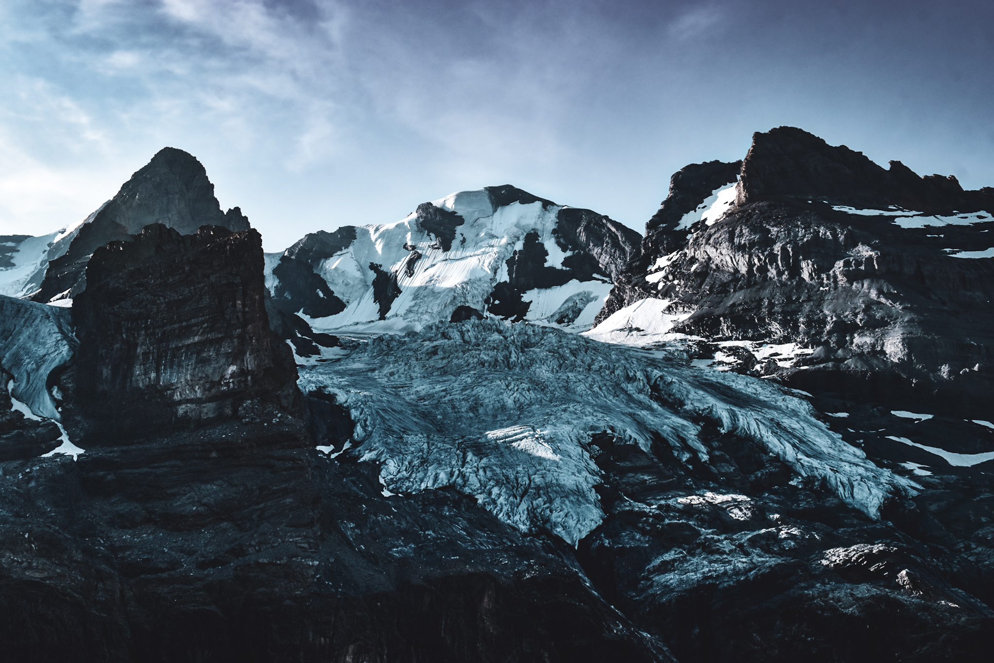 A glacier in between two massive mountains in the Swiss Alps