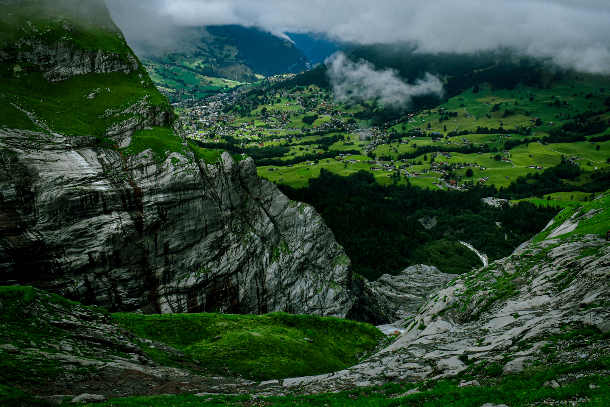 the town a grindelwald seen high above from a trail used for hut to hut hiking in switzerland