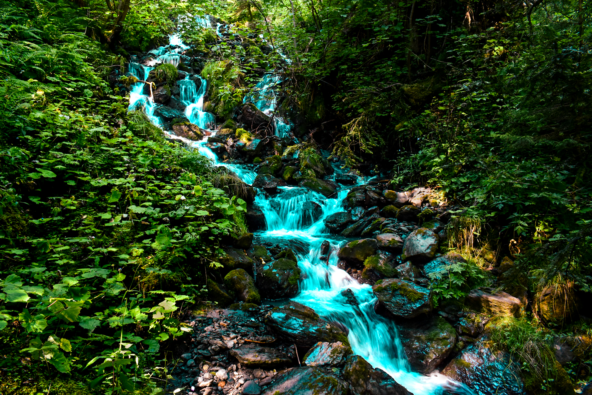 water flows through a creek near Lauterbrunnen Switzerland