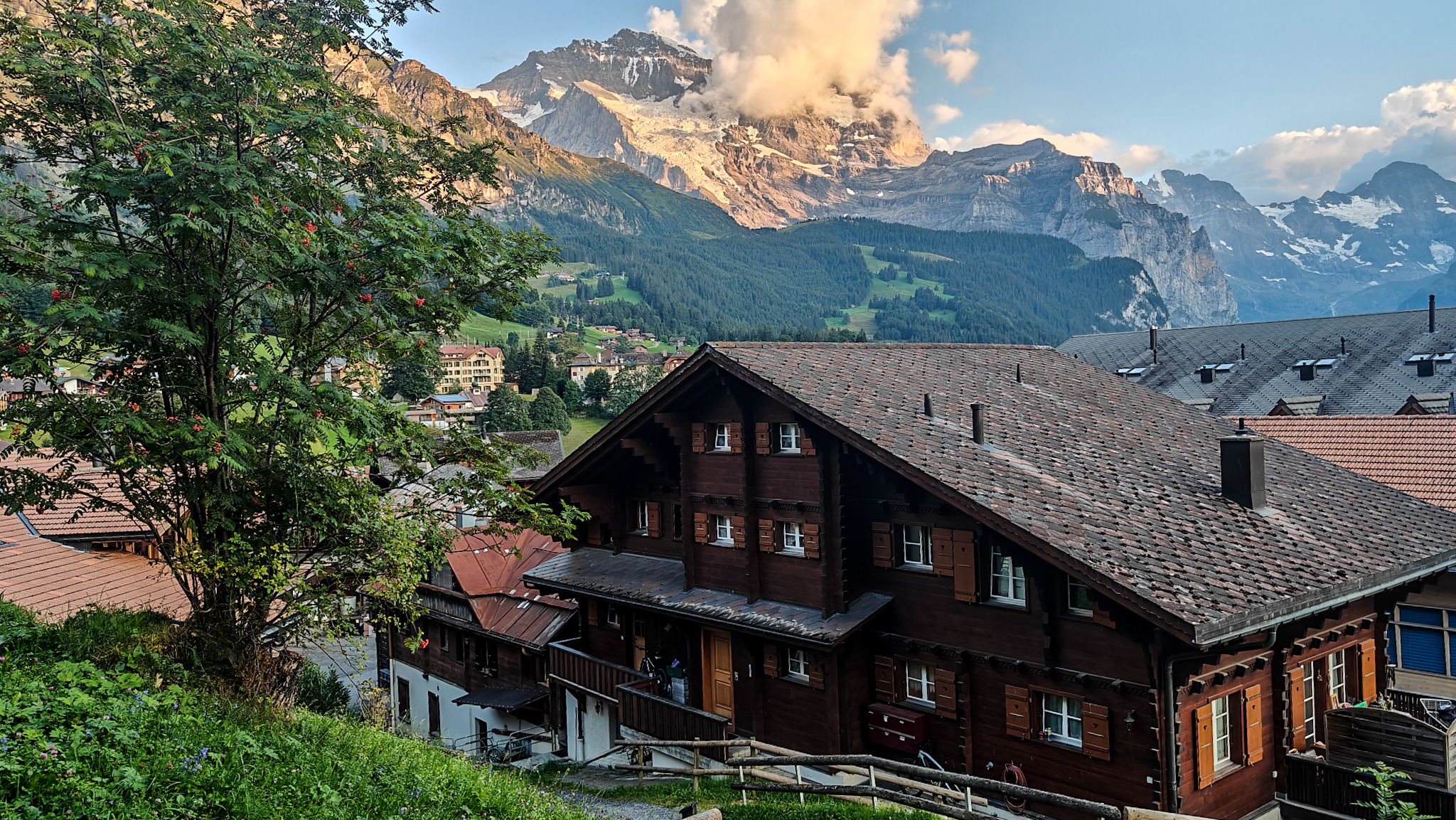 The sun rises on a mountain in Switzerland in the town of Wengen, a popular place to rest during a hut to hut hike in Switzerland