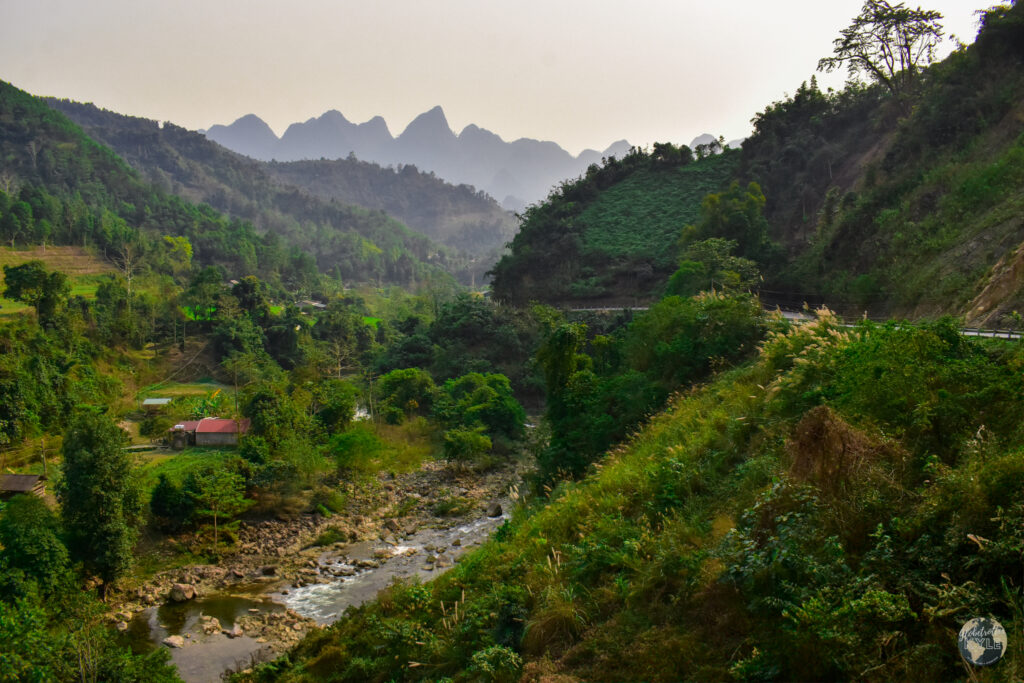 a river running through a valley in Ha Giang Vietnam