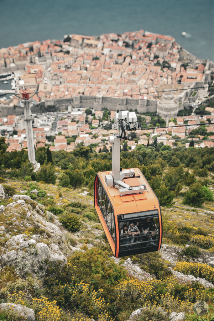 A cable car rises above Dubronik's old town, a must do in dubrovnik